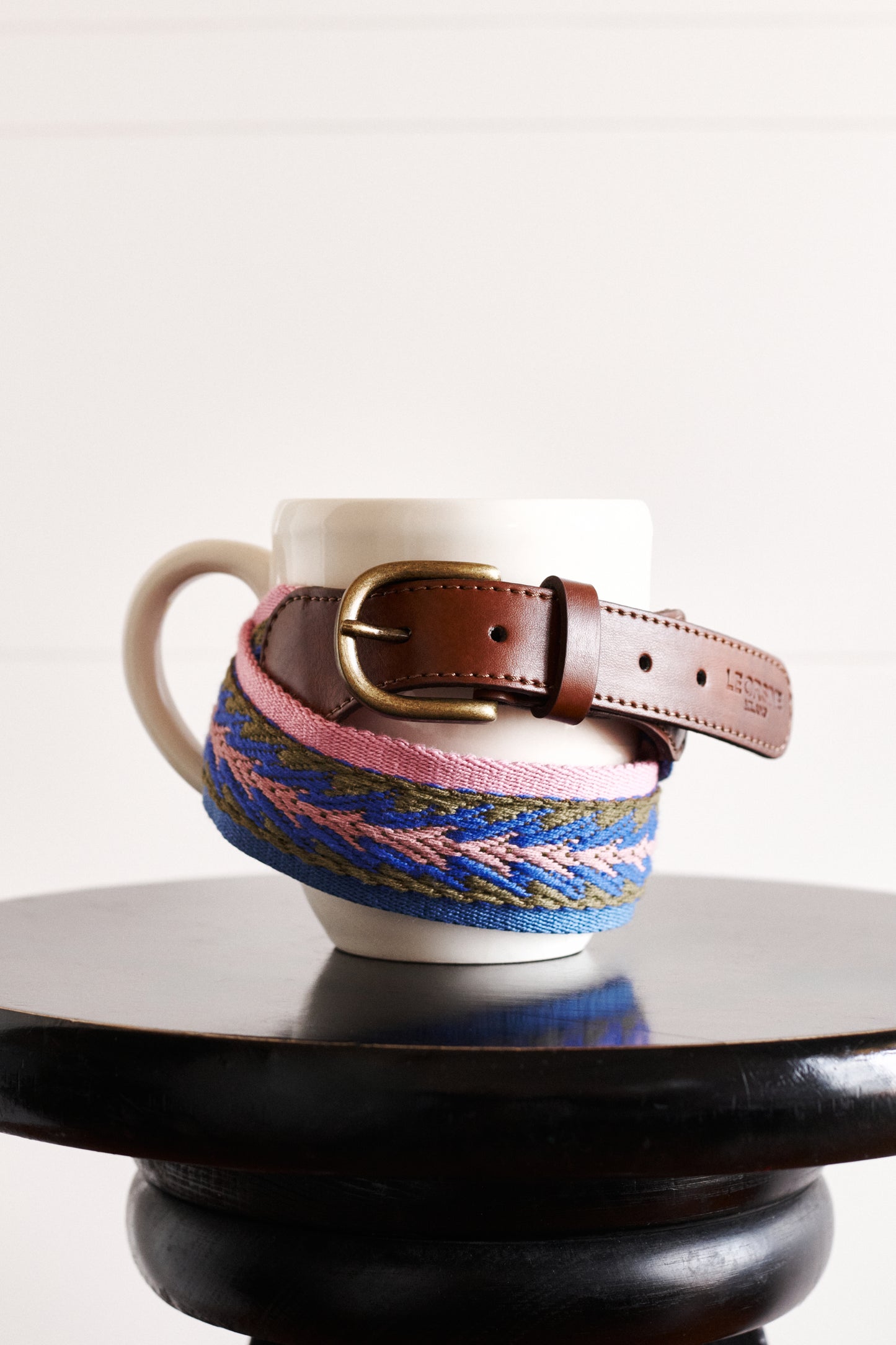 Vegan belt, embroidered, around a mug