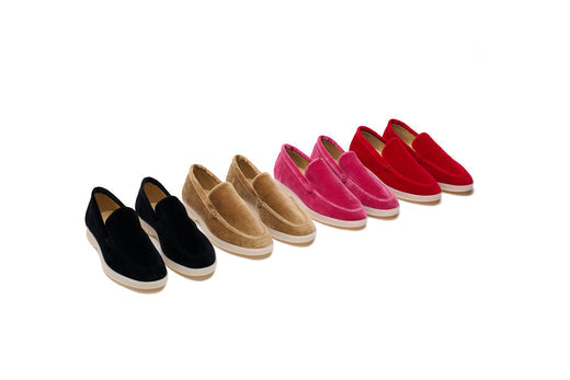 Various stylish shoes for professional look arranged in a row, showcasing colors from black to red.