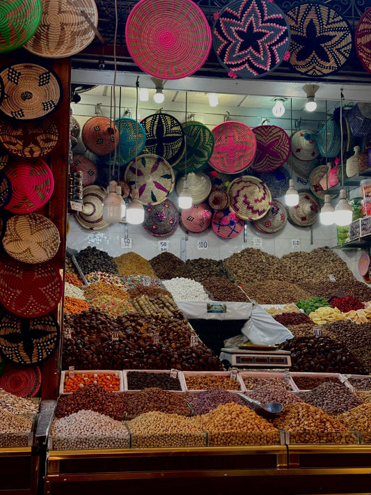 Ringing in the New Year in Marrakech and Beyond with colorful spices and woven baskets displayed at a local market.