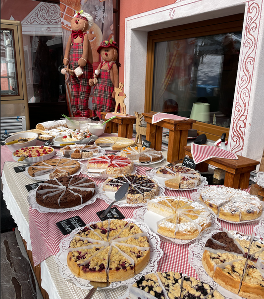 Trekking in Sankt Moritz and Sleeping at Lodge Chamanna Georgy: Delicious selection of homemade cakes and pastries.