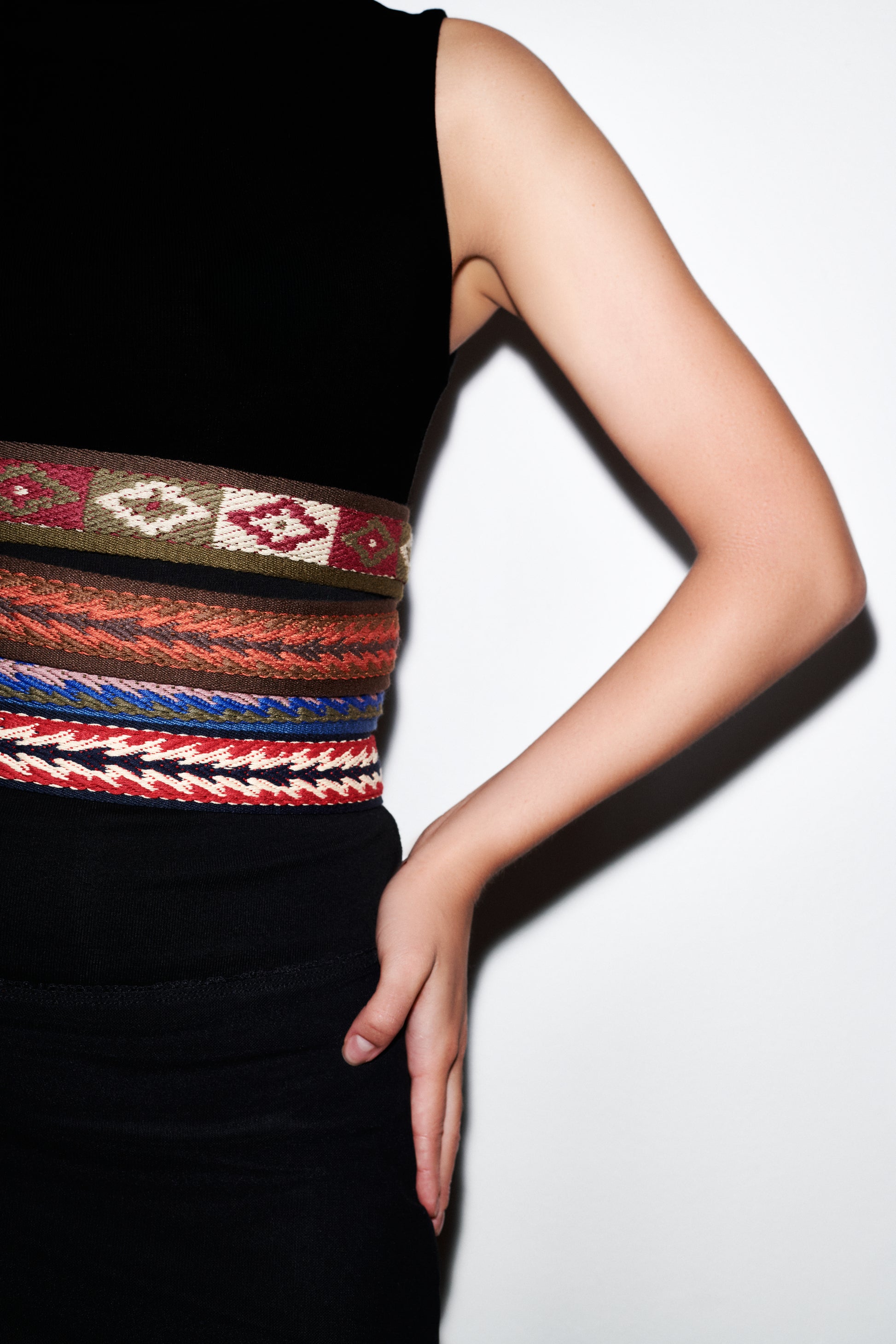 vegan leather belt with a gold buckle on a white background